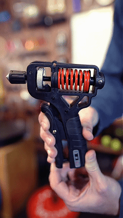 Hand demonstrating the adjustable grip strengthener